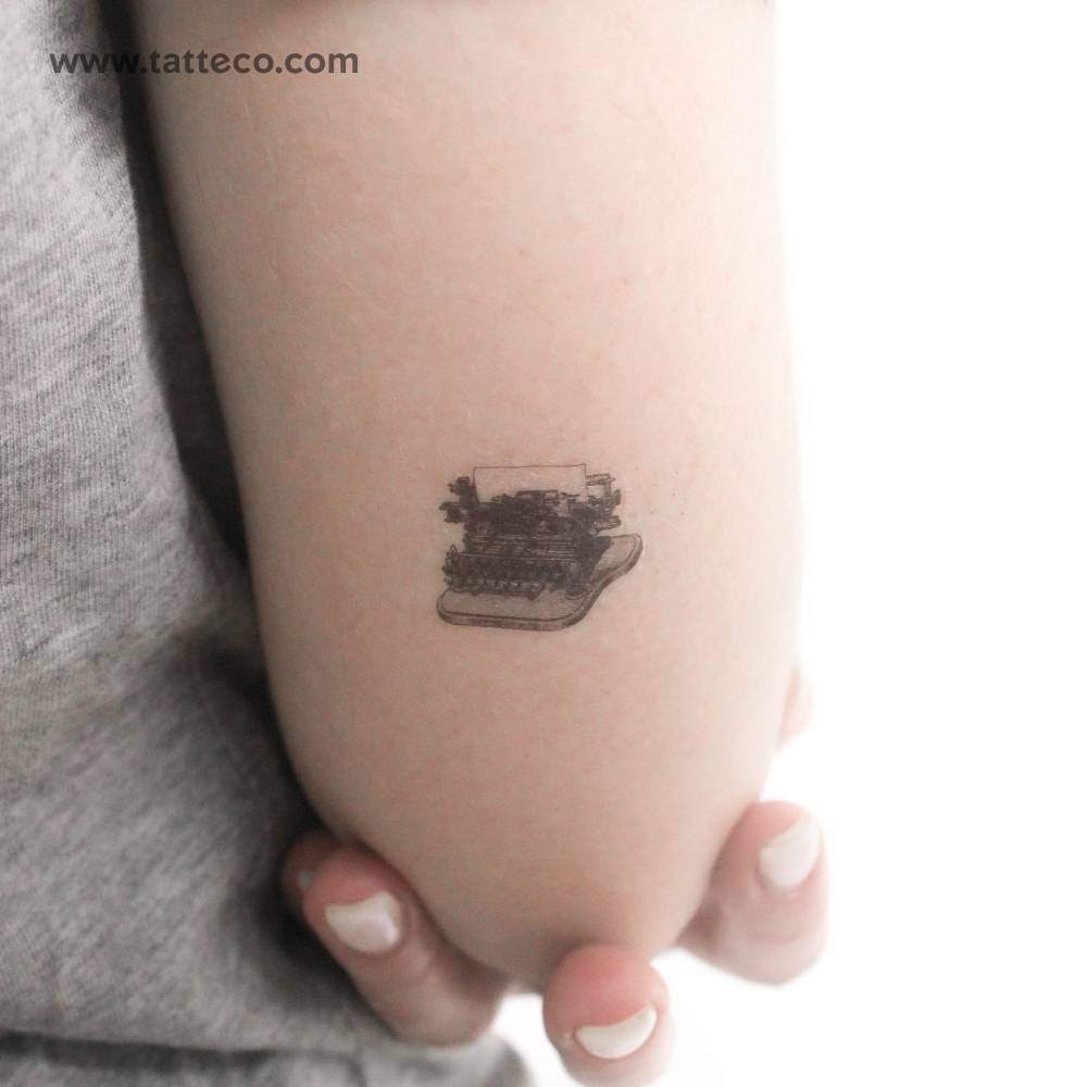 Typewriter temporary tattoo located on the tricep.