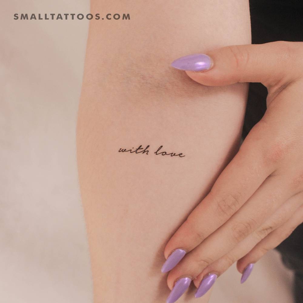 "With love" temporary lettering tattoo located on the inner forearm.