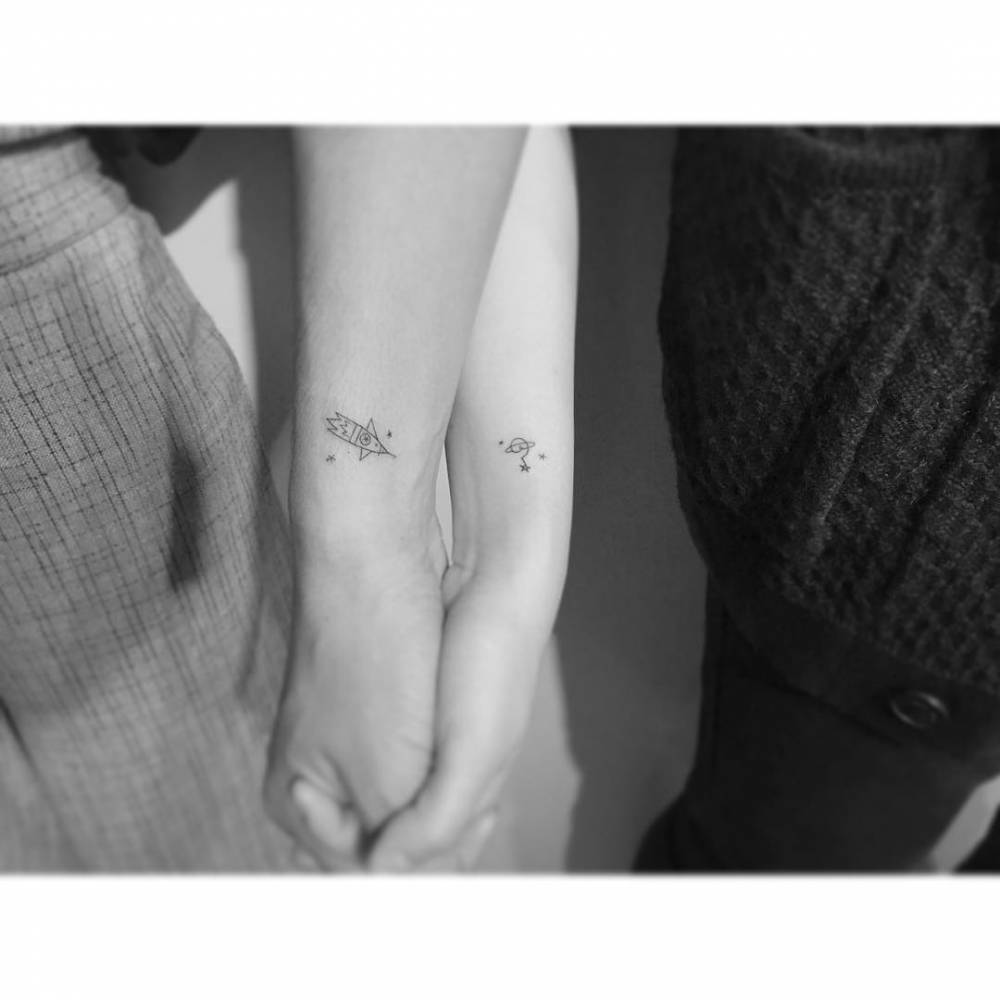 Matching rocket and galaxy tattoo for best friends.