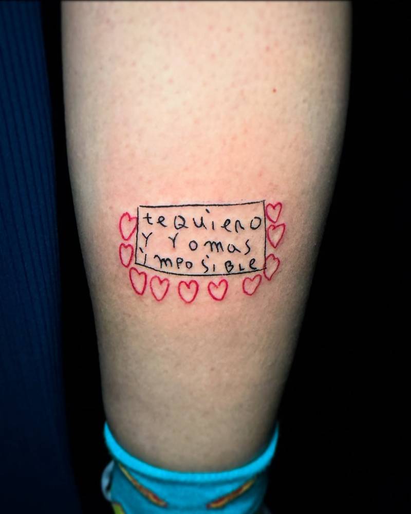 Child drawing tattooed on the calf, hand poked style.