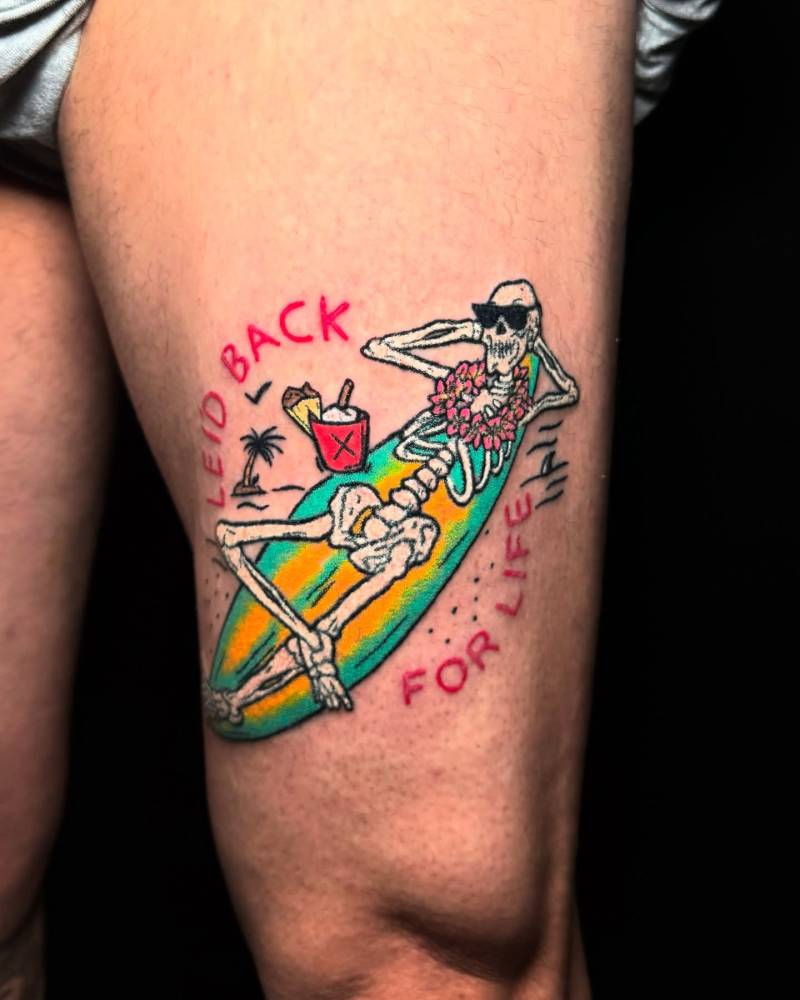 Chillin' skeleton tattooed on the thigh, hand poked style.