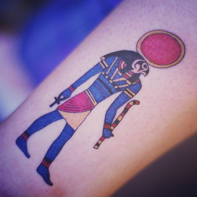 Ra tattoo located on the shin, illustrative style.