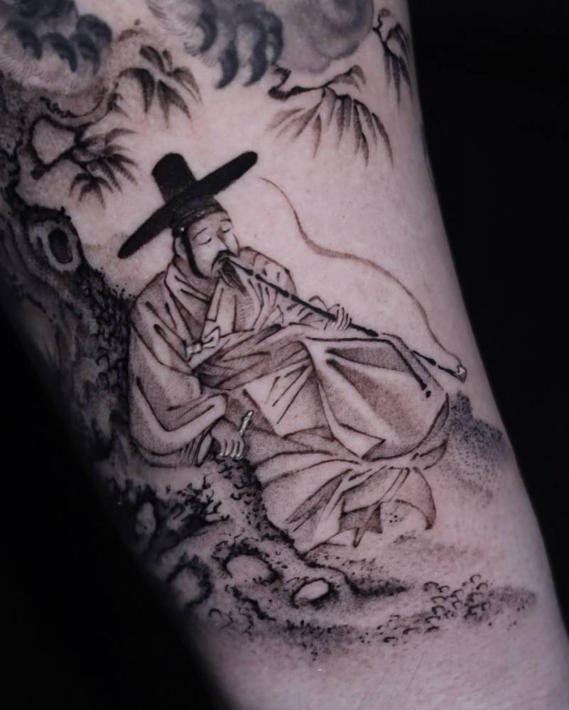 Korean figure tattooed on the inner forearm, oriental style.