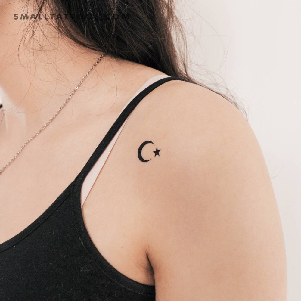 Star and crescent temporary tattoo located on the shoulder.