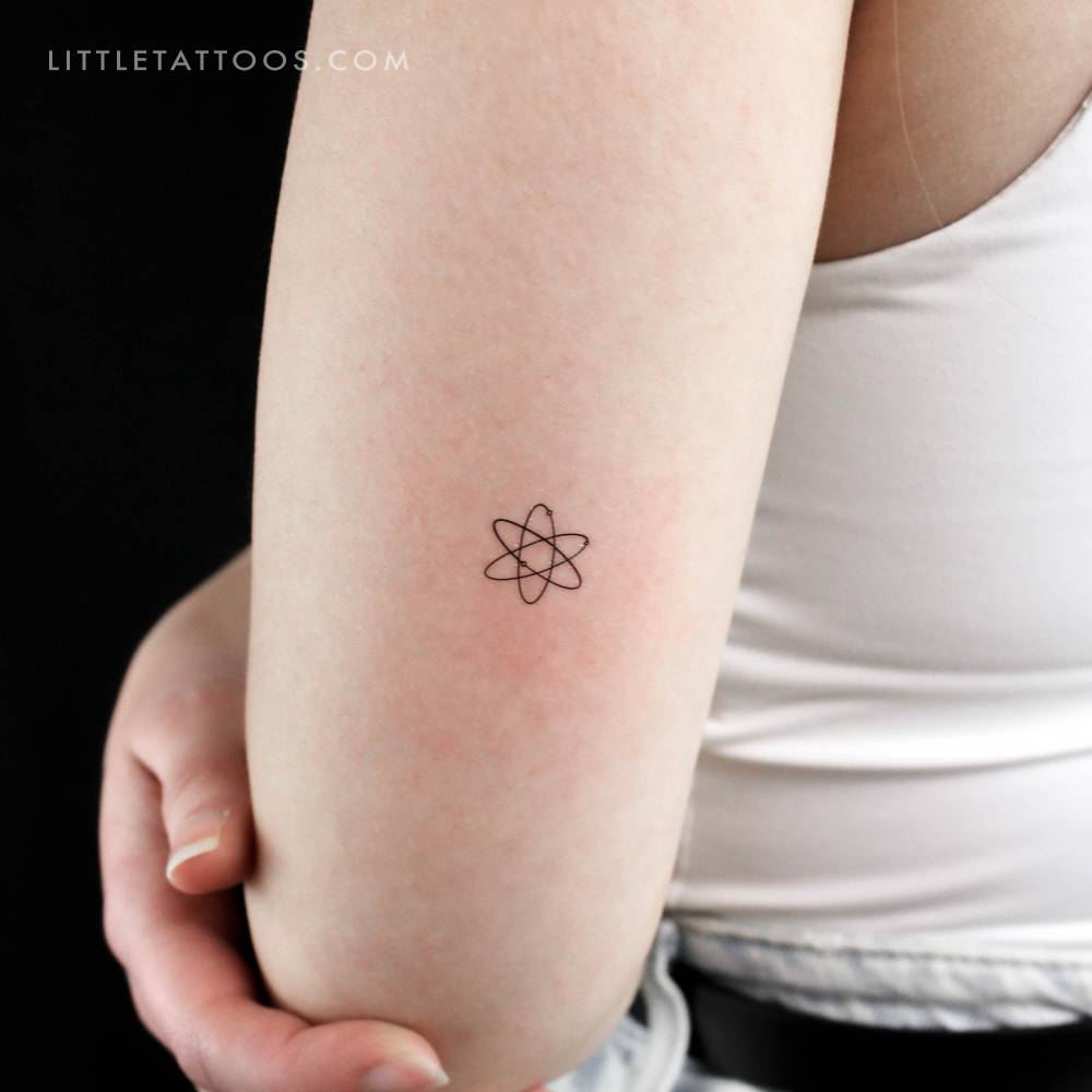 Atom temporary tattoo placed on the tricep.
