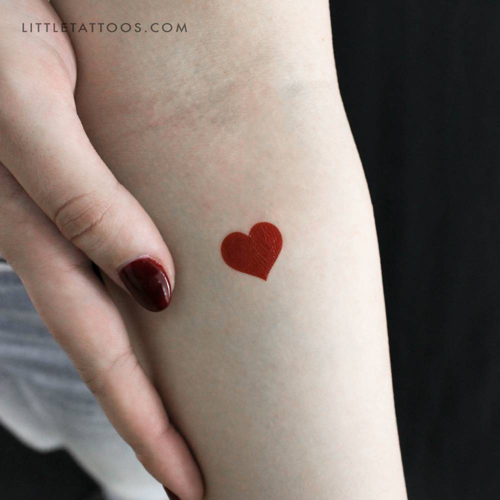 Little red heart temporary tattoo located on the inner forearm.