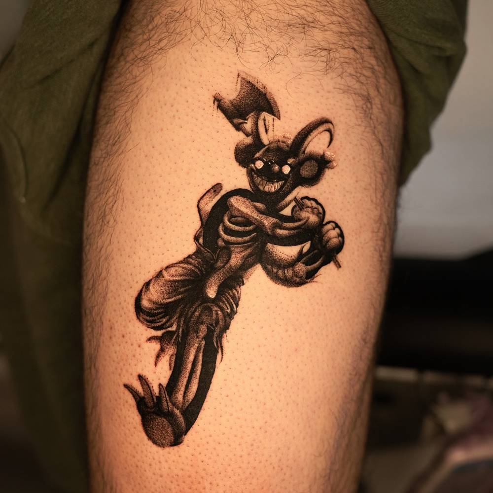 Evil teddy bear tattooed on the thigh, dotwork style.