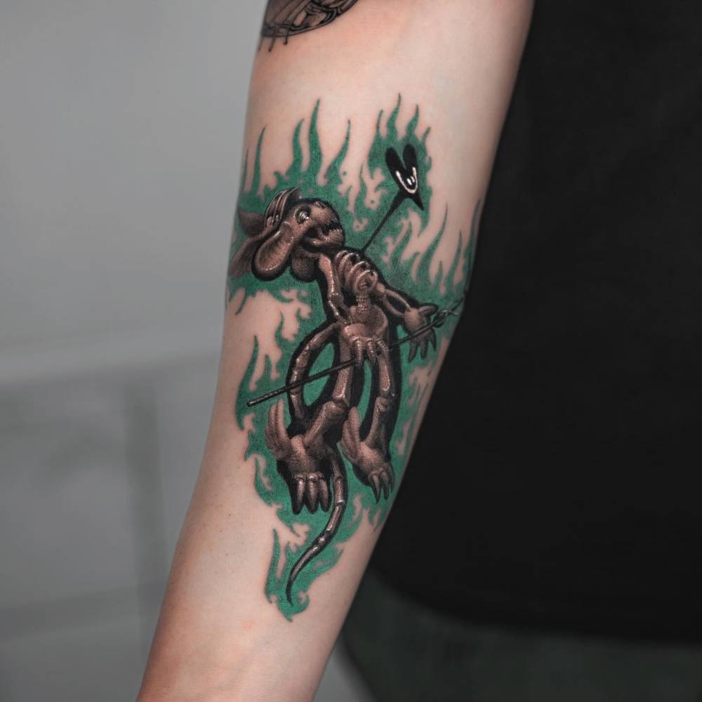 X-Ray teddy bear tattoo located on the inner forearm.