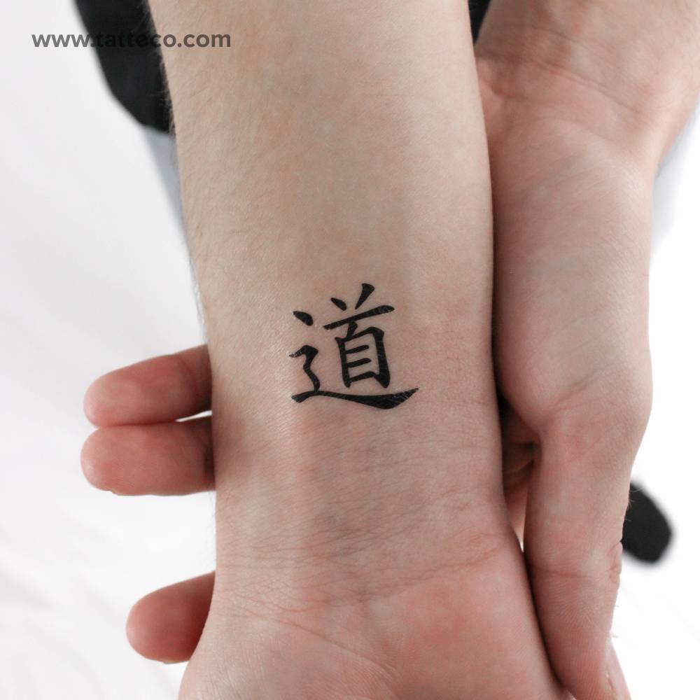 Tao temporary tattoo located on the wrist.