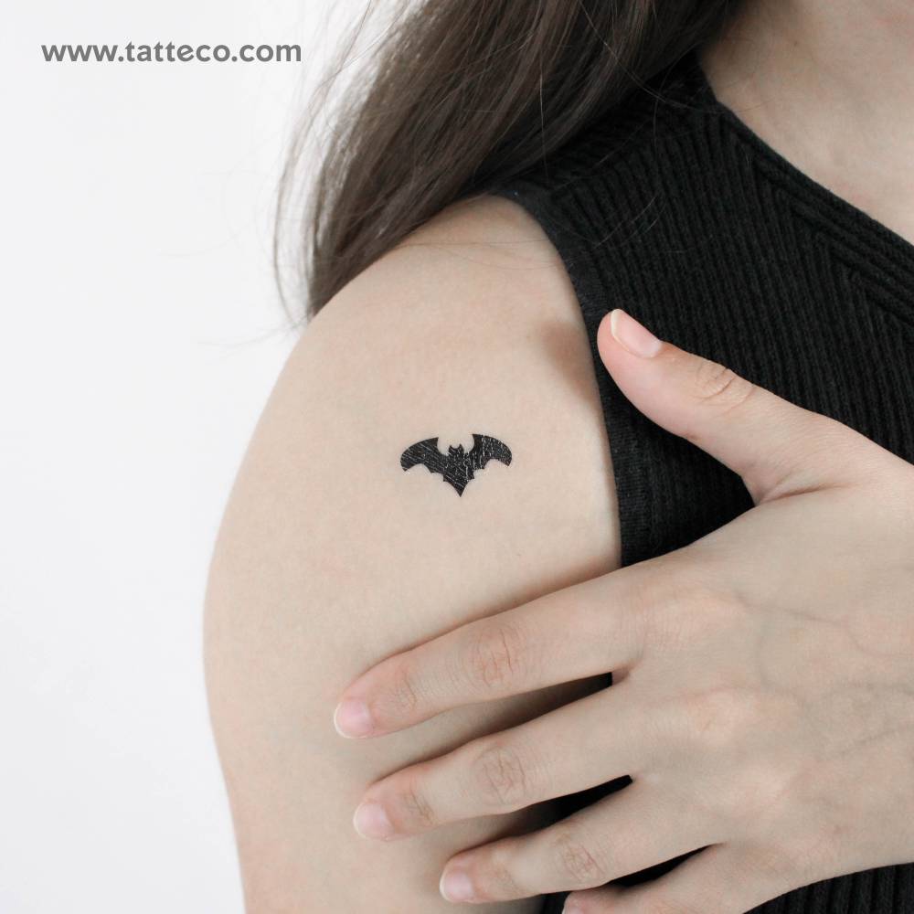 Bat temporary tattoo located on the shoulder.