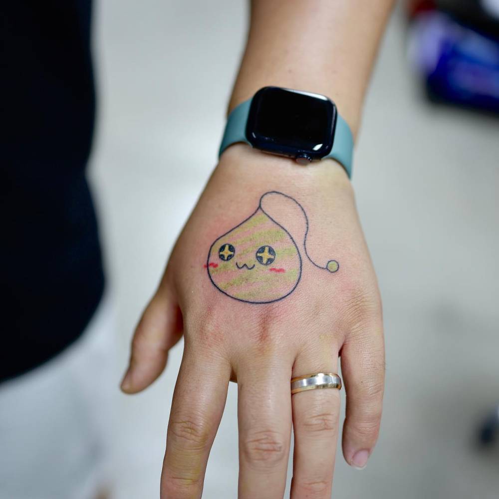 Slime from MapleStory tattooed on the hand, kawaii style.