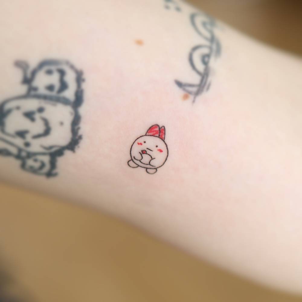 Usagi from Chiikawa tattooed on the inner arm, kawaii style.