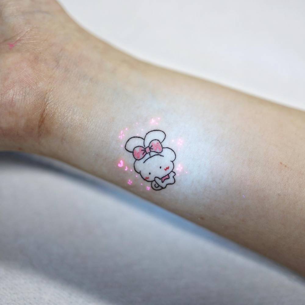 Kawaii style Cinnamoroll tattoo located on the wrist.