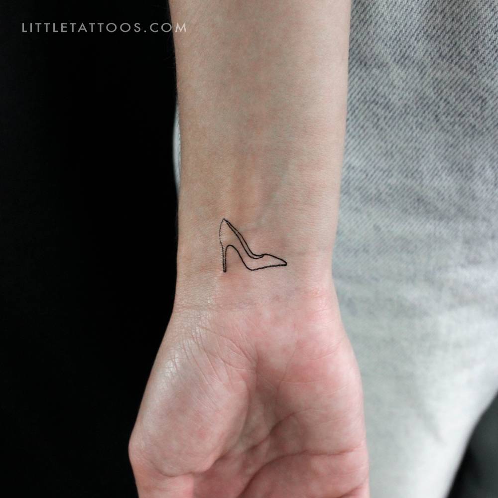 High heel temporary tattoo in fine line style located on the wrist.