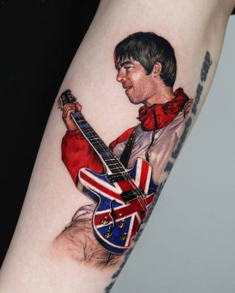 Noel Gallagher tattoo in micro-realistic style done on the forearm.
