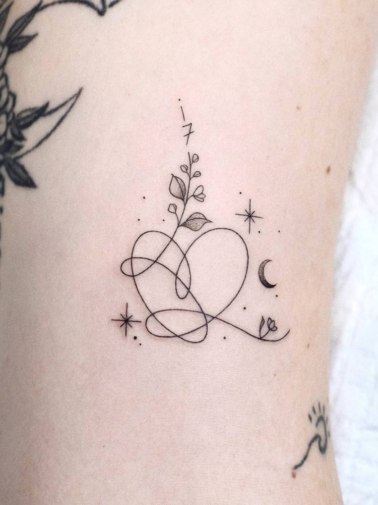 BTS heart tattoo located on the bicep.