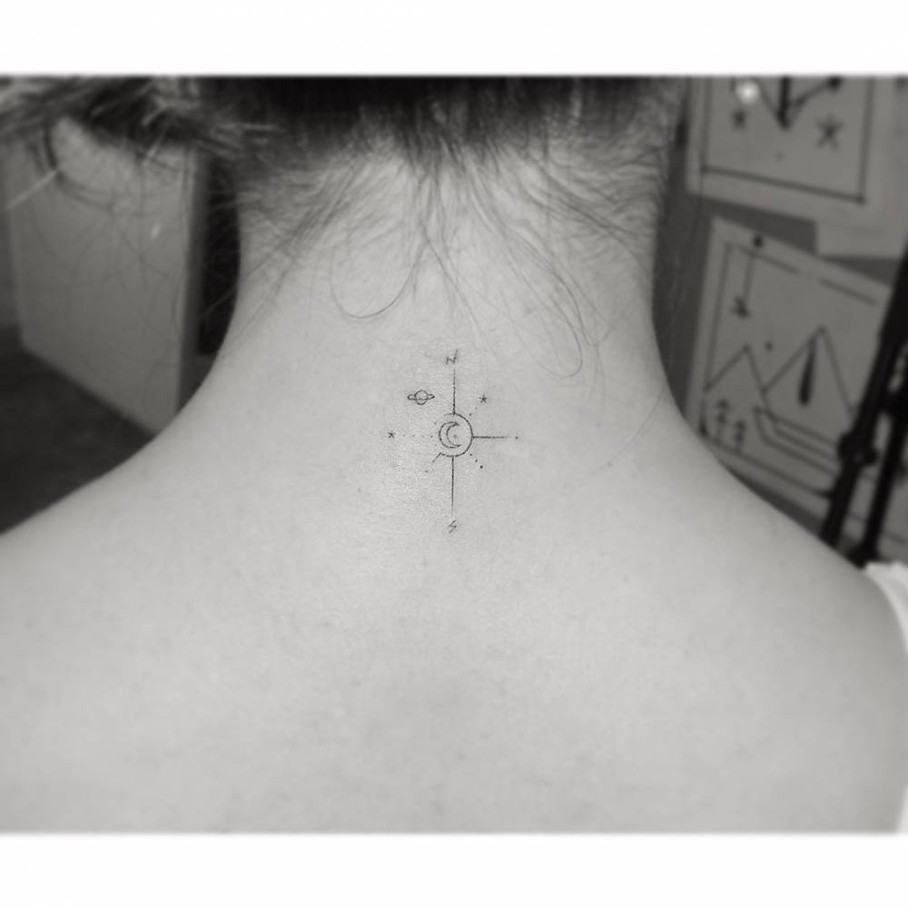 Compass rose tattooed on the back of the neck, minimalistic style.