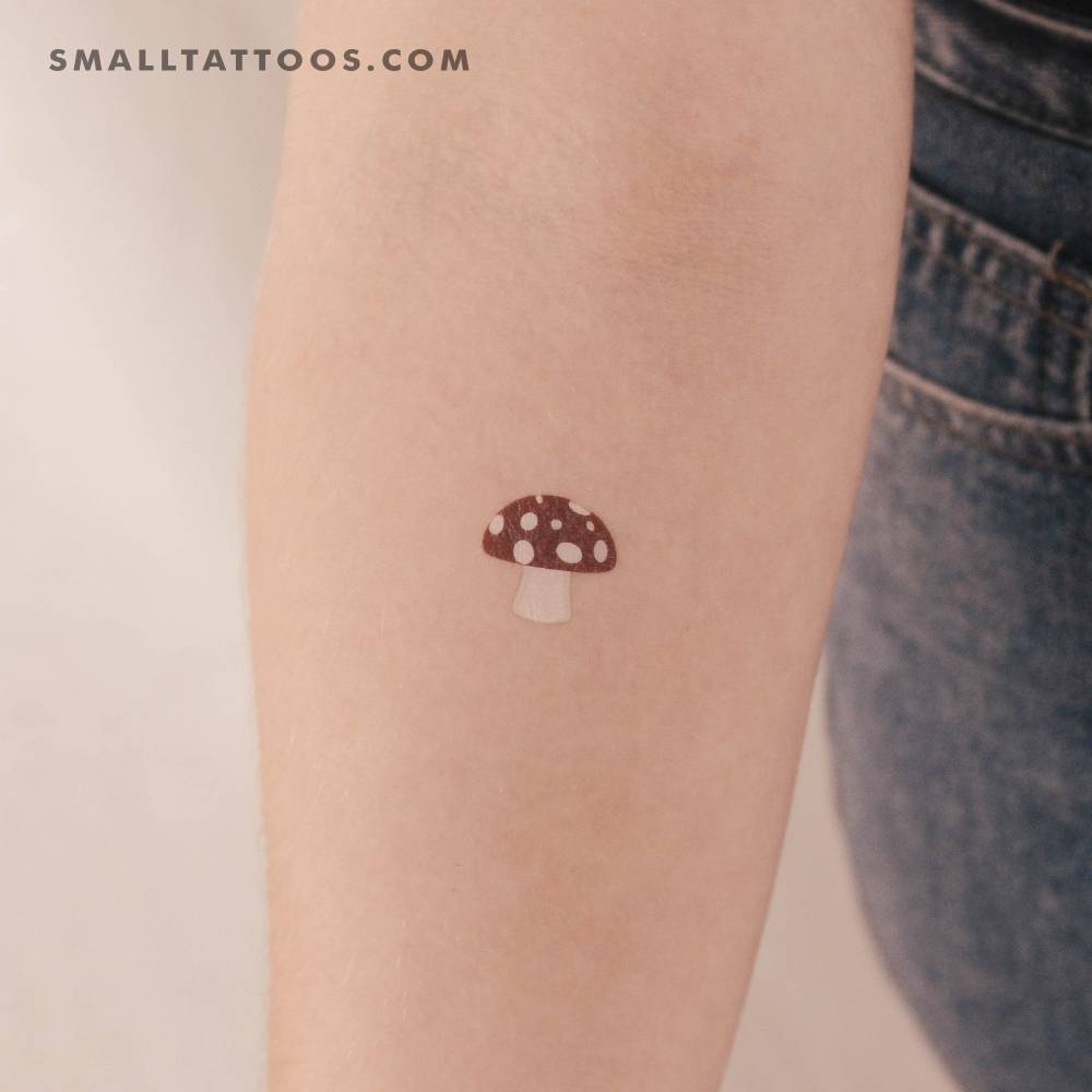 Red mushroom temporary tattoo located on the inner forearm.
