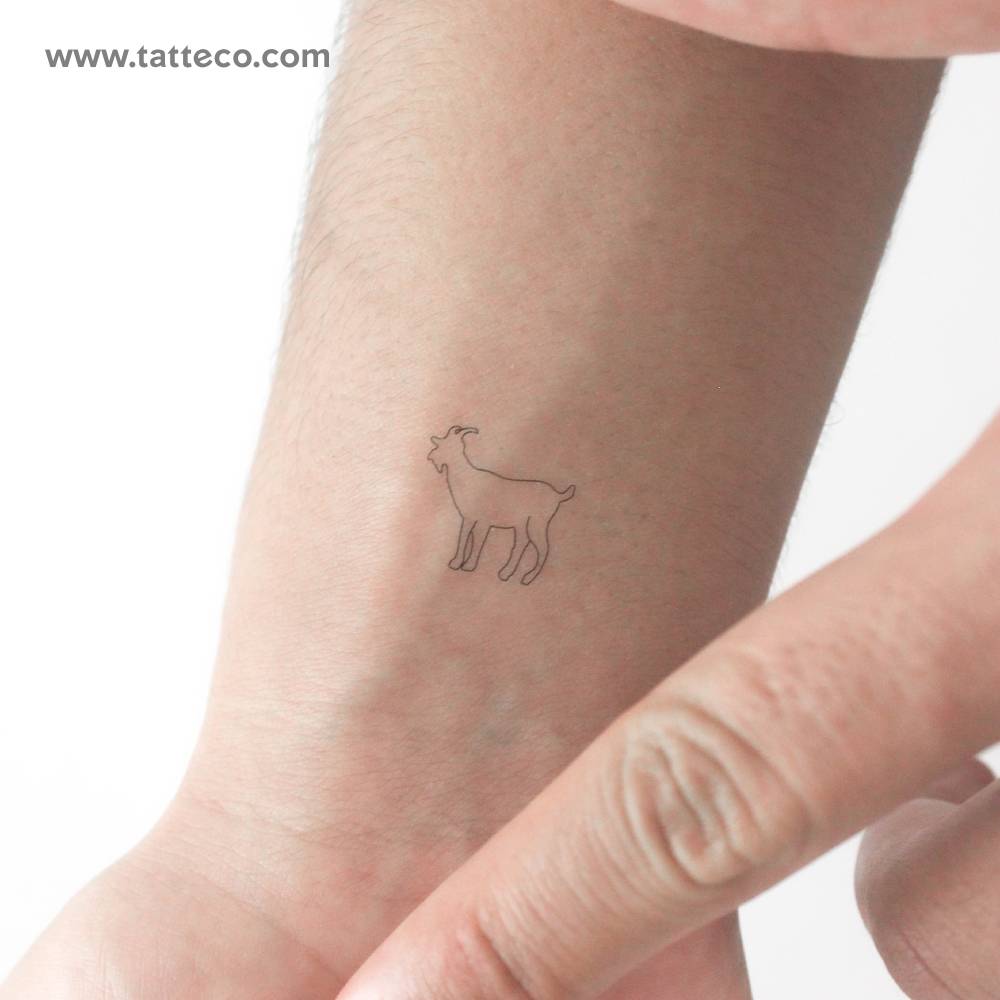 Little goat temporary tattoo in fine line style located on the wrist.
