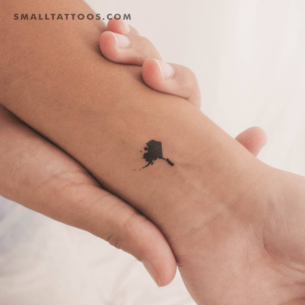 Alaska map temporary tattoo located on the wrist.