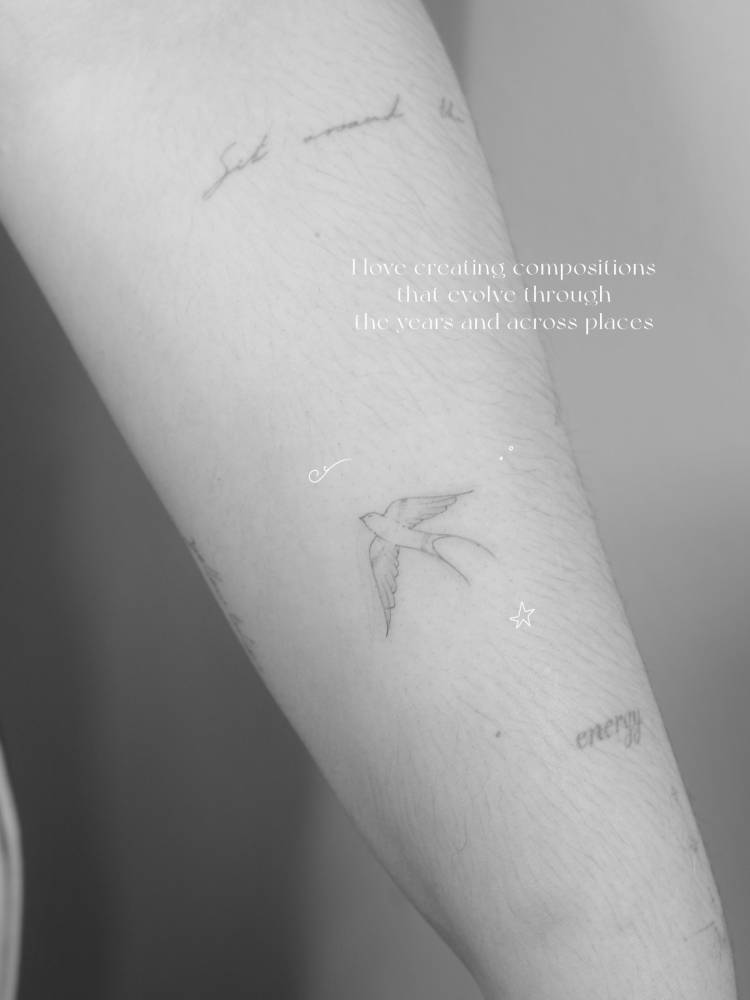 Fine line style swallow tattoo located on the inner forearm.