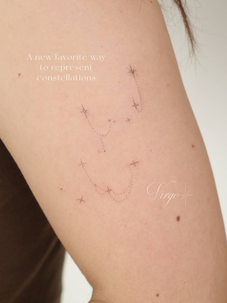 Ornamental sparkling stars tattooed on the upper arm.