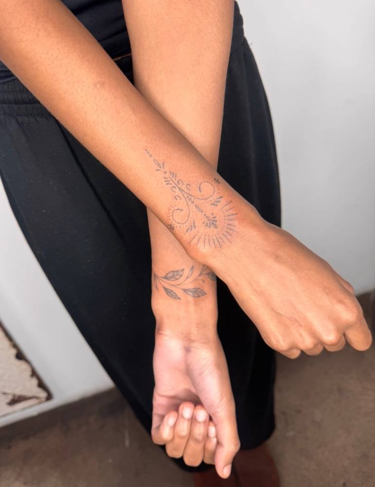 healed ornamental design tattooed on the wrist.