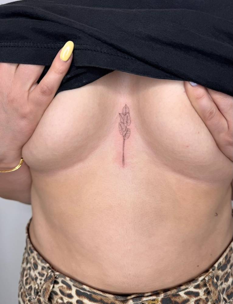 Anthurium tattoo located on the sternum, done in fine line style.