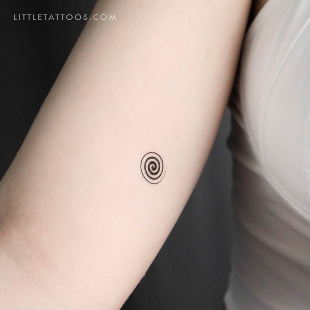 Little spiral temporary tattoo located on the inner arm.