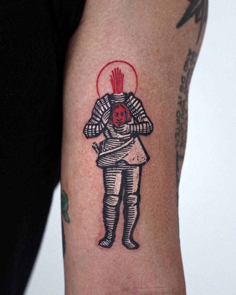 Saint Livier by Jacques Callot tattooed on the bicep.