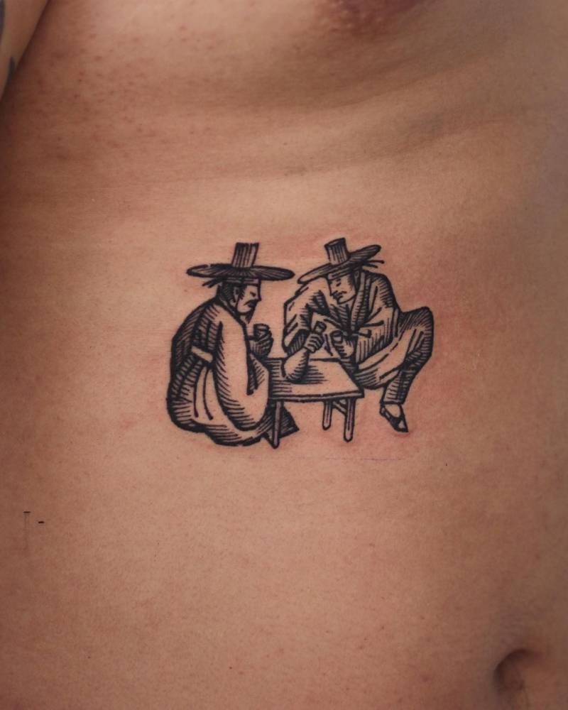Engraving style Korean culture tattoo located on the rib.