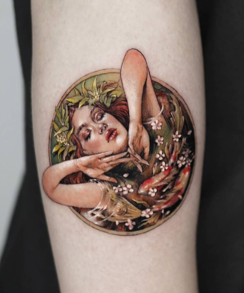 Art Nouveau style woman portrait tattoo located on the forearm.