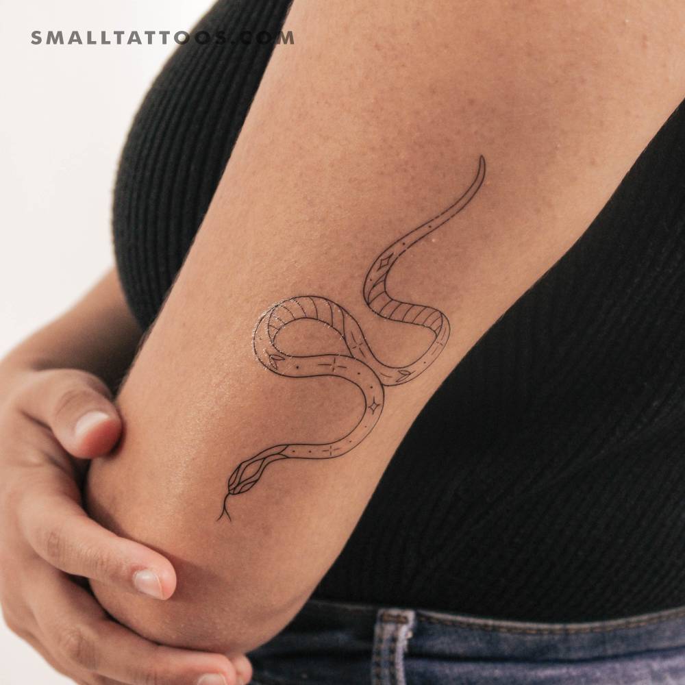 Snake temporary tattoo by 1991.ink located on the tricep.