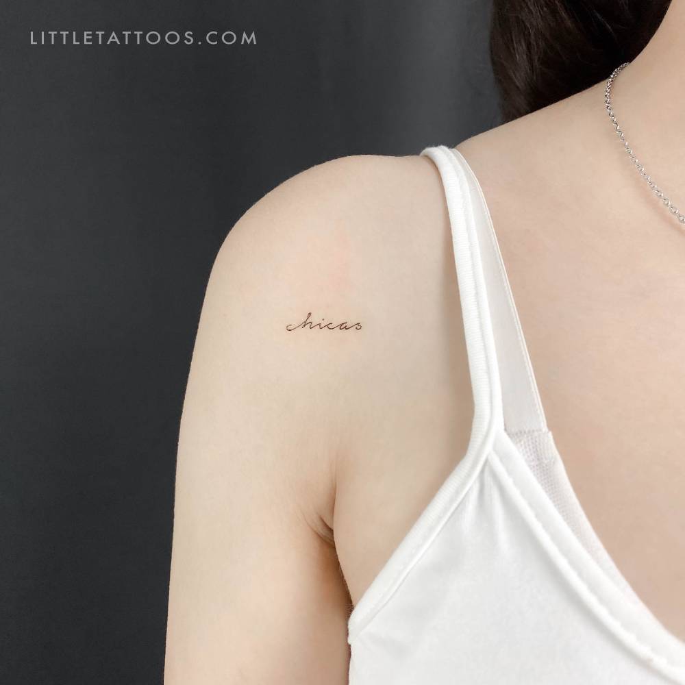 Handwritten font word "chicas" temporary tattoo located on the shoulder.