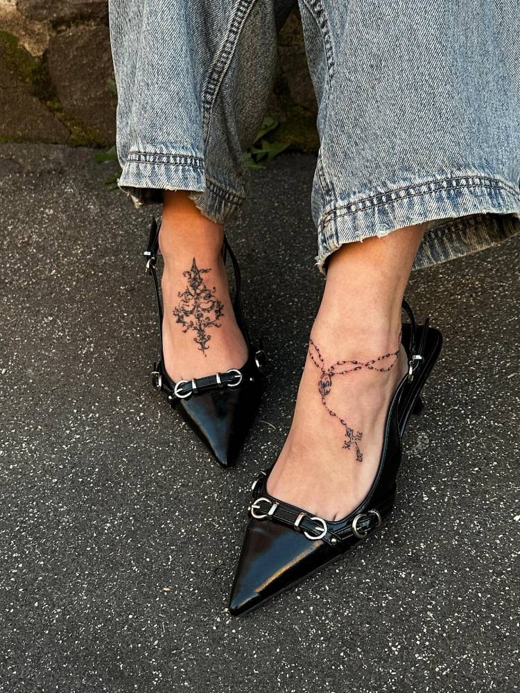 Rosary tattoo in illustrative style located on the foot.