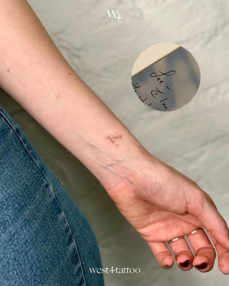 Handwritten font name "Lee" tattooed on the wrist.
