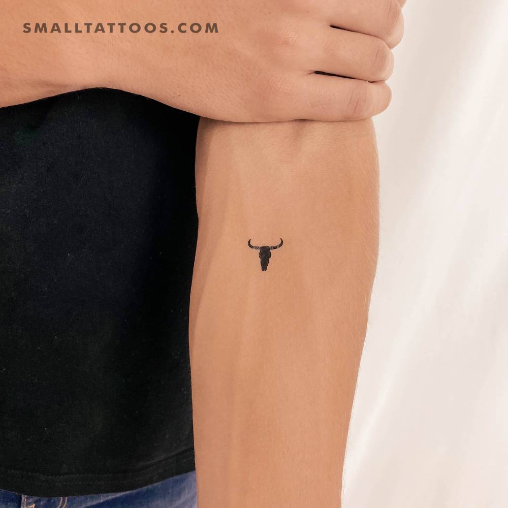 Bull skull temporary tattoo in minimalistic style.