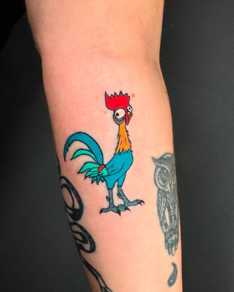 Hand poked Heihei tattoo located on the forearm.