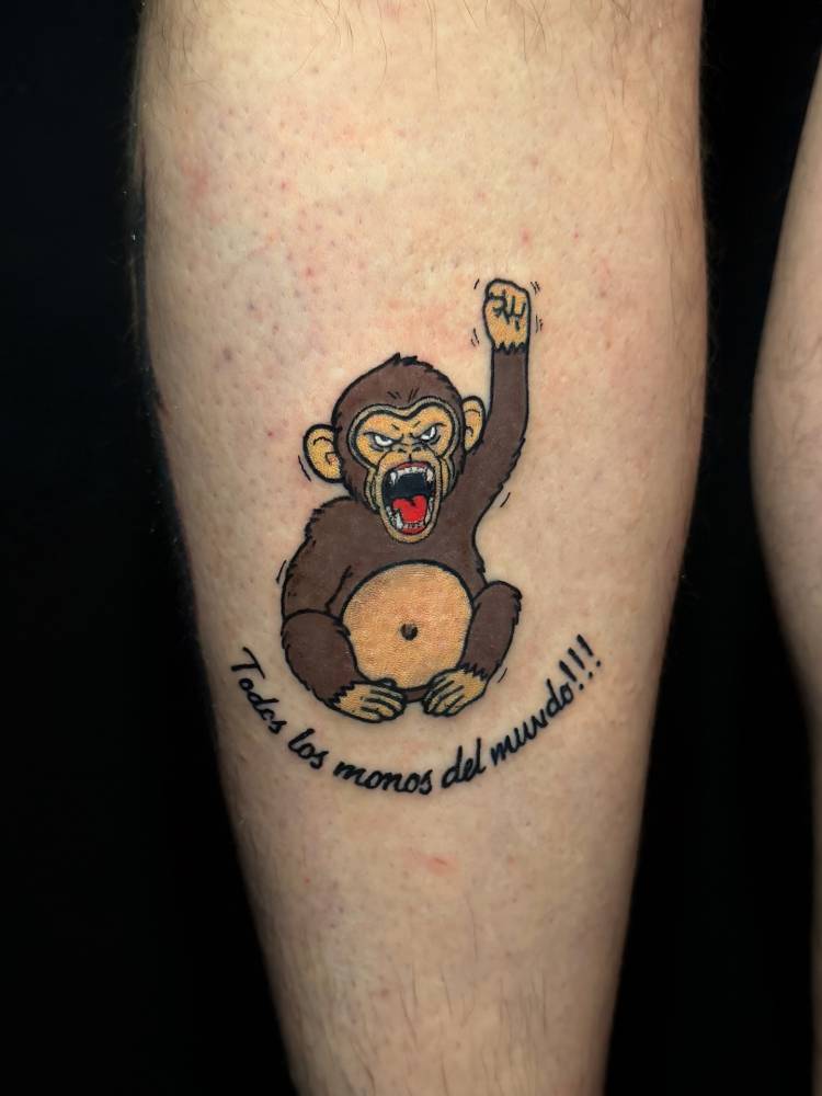 Angry chimp tattoo located on the shin, hand poked style.