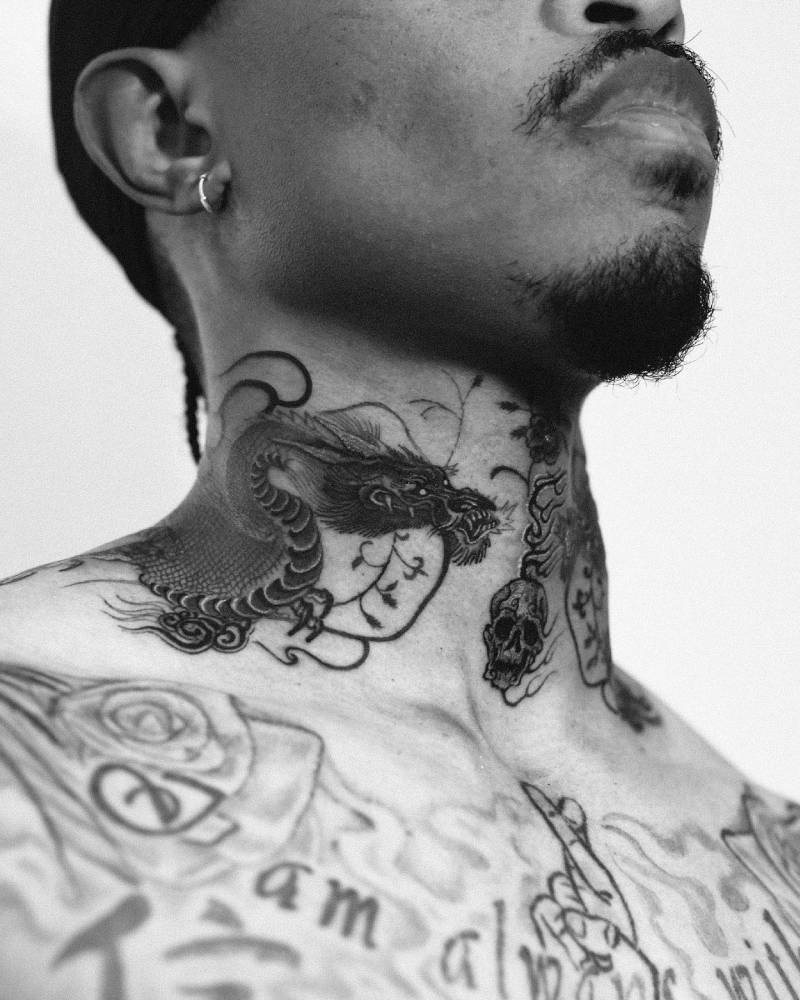Oriental style dragon tattoo located on the neck.