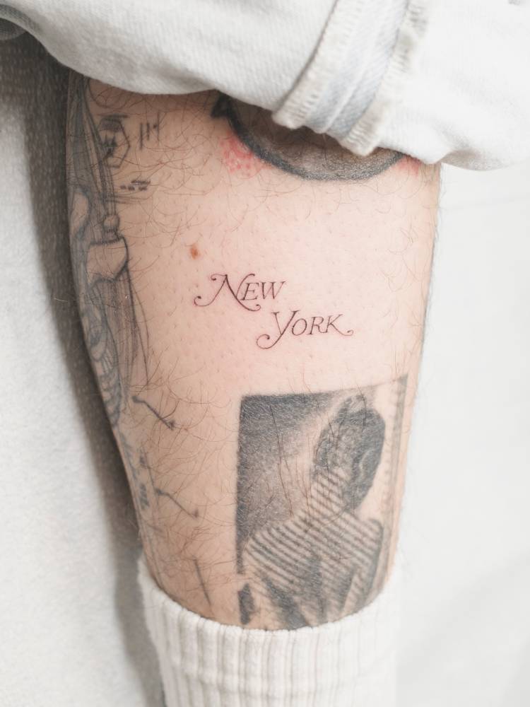 New York Magazine logo tattooed on the shin.