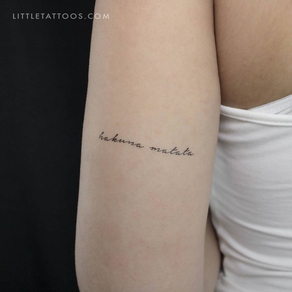 "Hakuna Matata" temporary tattoo located on the tricep.
