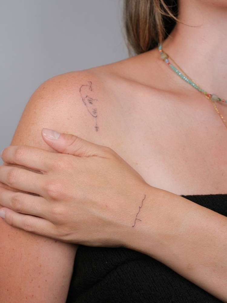 Lettering tattoo of the name "Eymen" located on the wrist.