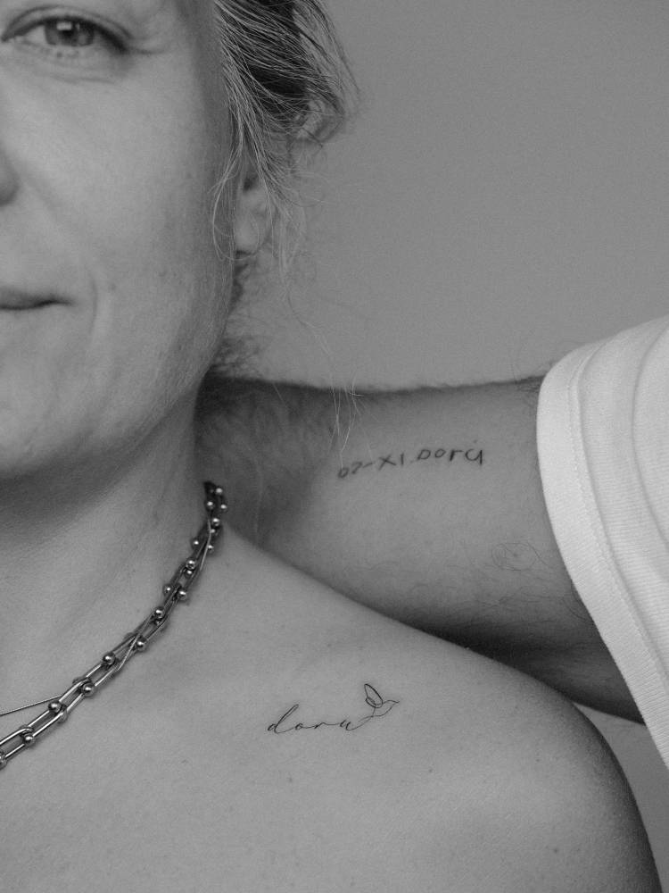 A mother carrying her child’s name, and a father carrying their child’s handwriting. A timeless reminder that family is everything