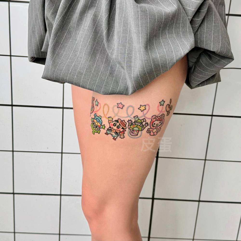 Toy Story tattoo in kawaii style located on the thigh.