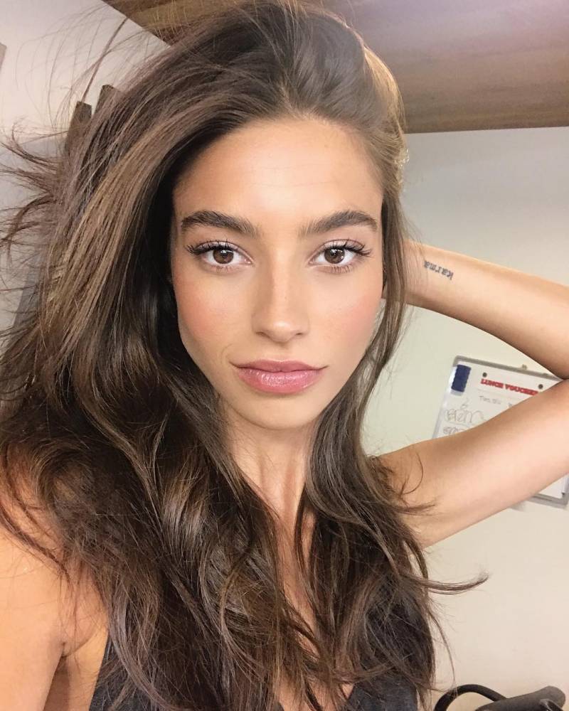 Word "karma" tattooed on Rocío Crusset's wrist.