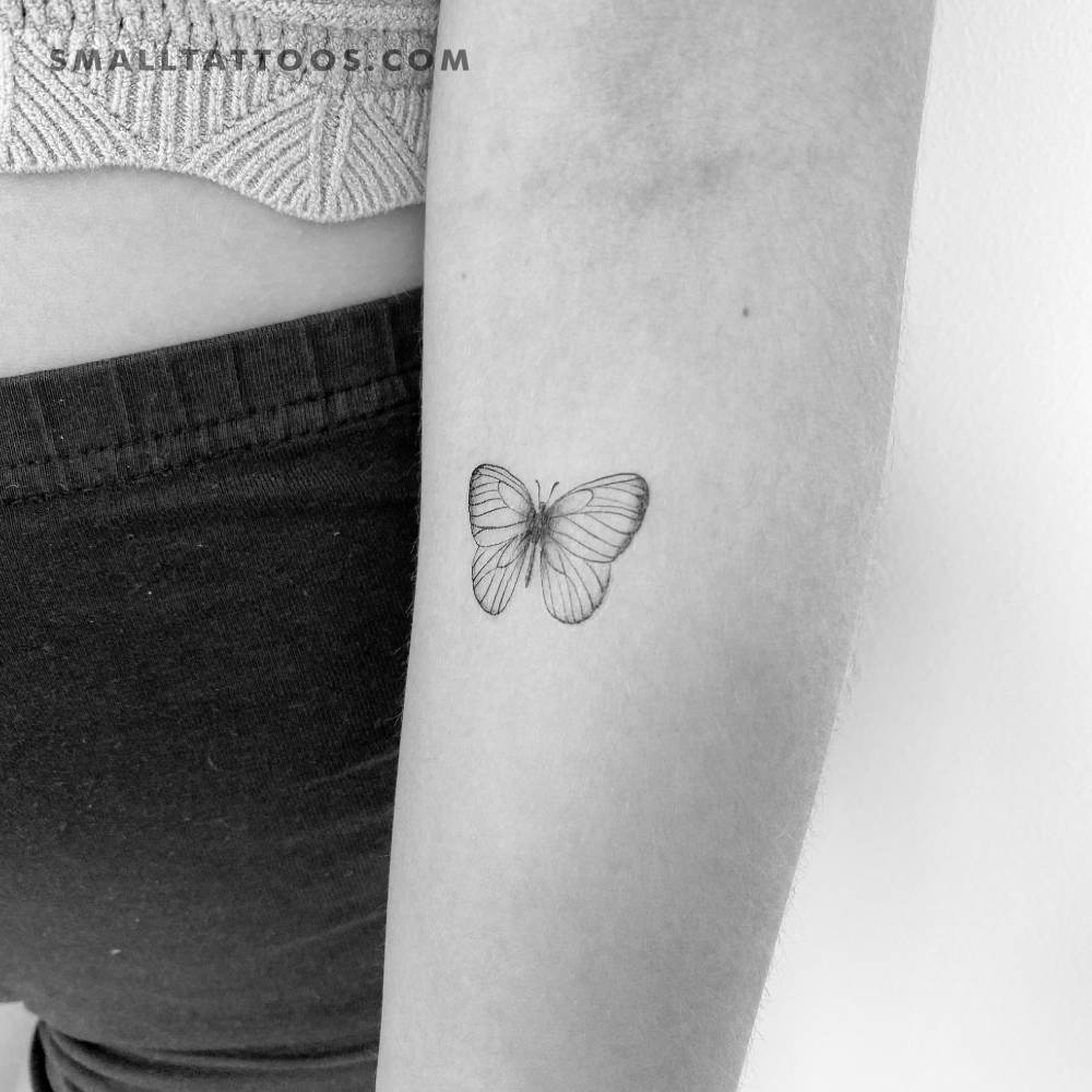 Illustrative style butterfly temporary tattoo located on the inner forearm.