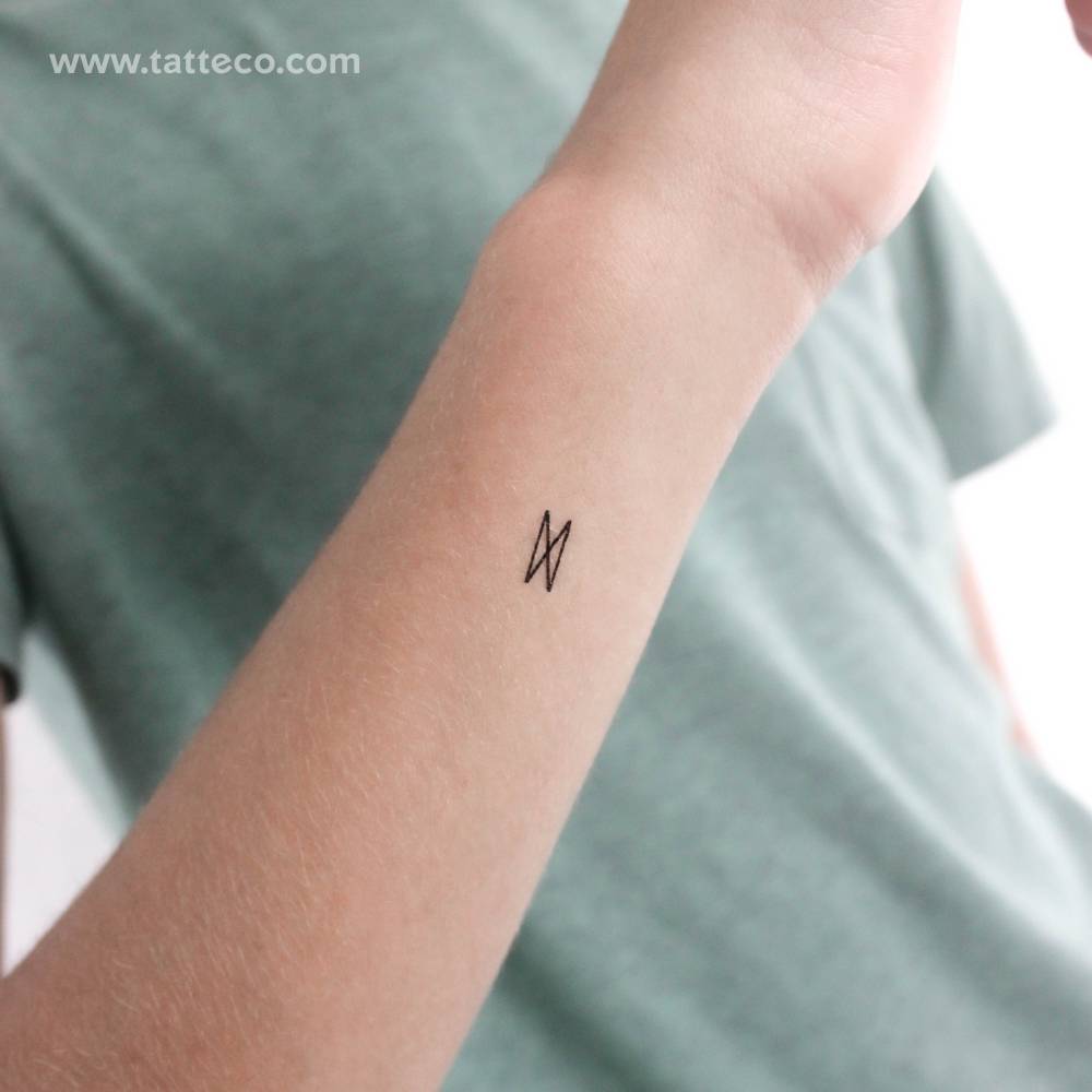 Dagaz rune temporary tattoo placed on the wrist.