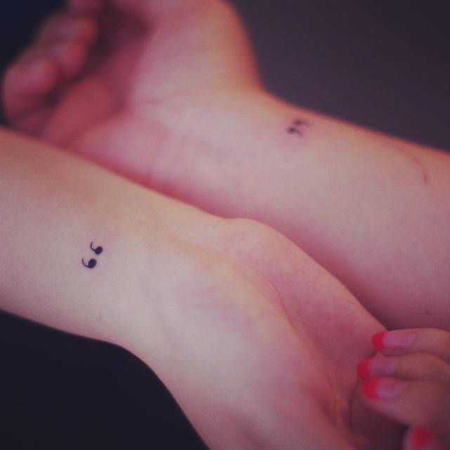 Matching minimalist quotation mark tattoo for best friends.