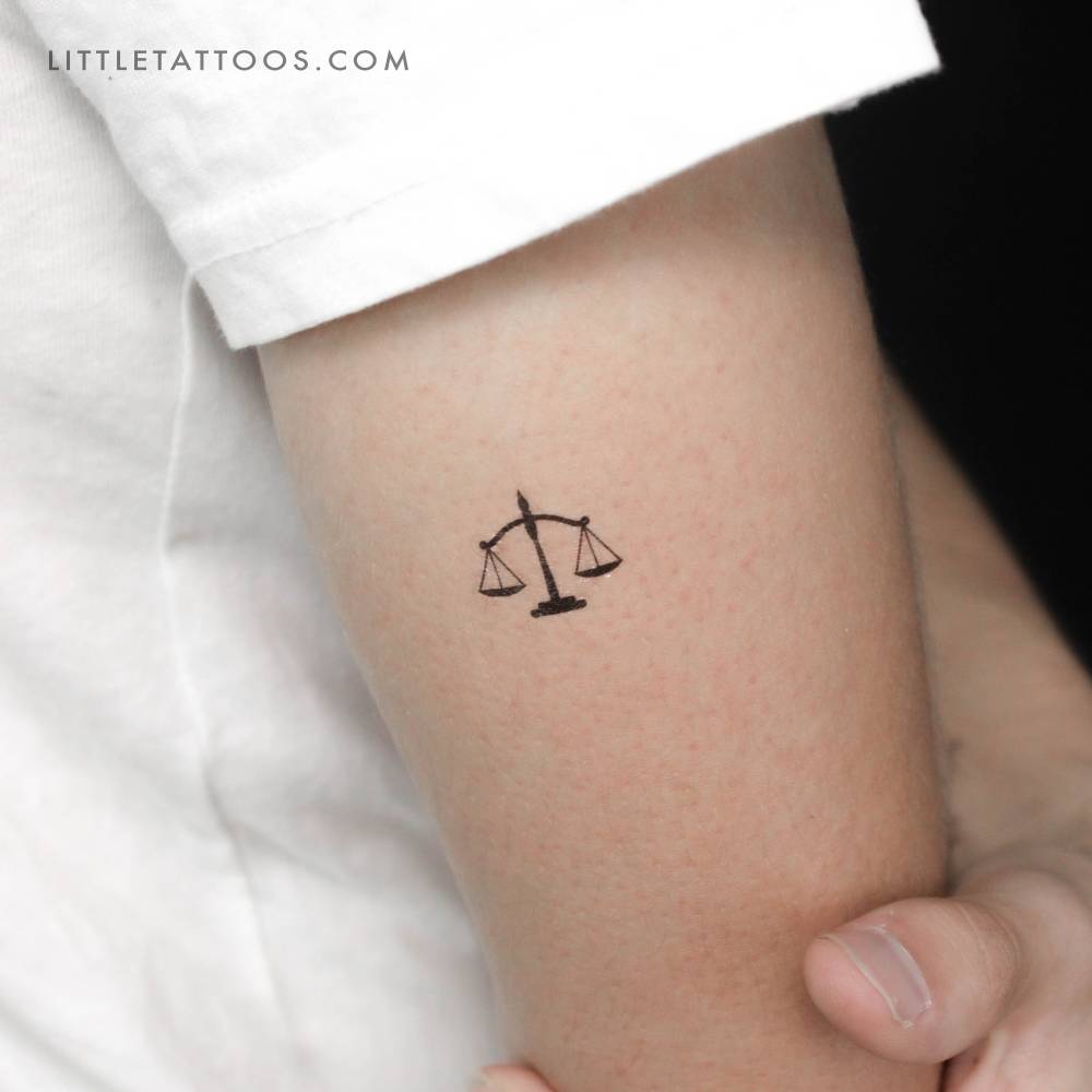 Scale temporary tattoo placed on the tricep.